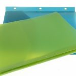 A translucent green folder, manufactured as quality stationery in China, is placed atop a blue folder with metal-reinforced holes along the edge, both set against a white background.