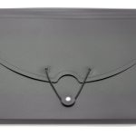 A closed black expanding file folder with a string and button closure, manufactured in China, placed on a white background.