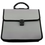 A closed, light gray briefcase with black trim, a black handle, and a front claspโideal for professionals or those interested in Manufacturing Stationery Items in Chinaโshown against a white background.