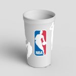 A white cup featuring the NBA logo and white silhouettes of basketball players in various action poses.