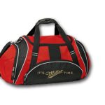 A red and black duffel bag with black handles and the phrase "IT'S MILLER TIME." printed on the front pocket.