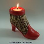 A candle holder shaped like a red high-heeled boot with a lit tealight on top; dimensions 13x6x11 cm and code JY29004-5 shown below.