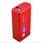 A red portable power bank with a USB output port, LED indicator lights, and a power button is shown standing upright.