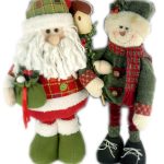 Two plush holiday dolls, one dressed as Santa Claus and the other as a snowman, both wearing festive green and red outfits, stand side by side.