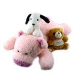 Three stuffed animals: a large pink pig, a small white dog with black ears sitting on the pig, and a small brown bear with a "CONRAD" label, all on a white background.