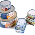 A set of six plastic food storage containers with clear lids in various sizes, arranged in two stacks on a white background.
