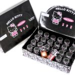 Box of Hello Kitty branded nail polishes with multiple bottles in various colors, packaging features Hello Kitty graphics and text.