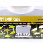A plastic hobby paint case with a handle, labeled for easy storage of miniature paints, displayed with paint bottles and colored paint swatches on the packaging.