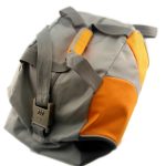 A gray and orange duffel bag with a front buckle and sturdy handles, photographed on a white background.