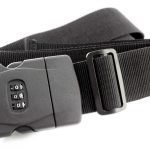 A black luggage strap with a three-digit combination lock on the buckle, shown against a white background.