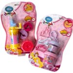 Two Disney Princess-themed dough playsets in pink packaging, each containing modeling dough and themed accessories for children aged 3 and up.