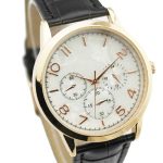 Gold wristwatch with a white dial, three subdials, gold hour markers, and a black leather strap.