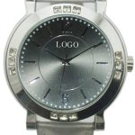 Silver wristwatch with a plain face labeled "LOGO," crystal accents around the bezel, and a matching silver leather strap.
