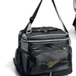 A black and gray soft cooler bag with side mesh pockets and a shoulder strap, displaying the phrase "It's Miller Time" on the front pocket.