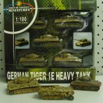 SAMSUNG DIGITAL CAMERA Box of 1:100 scale German Tiger 1E heavy tank miniatures, with three tank models displayed in front of the packaging.